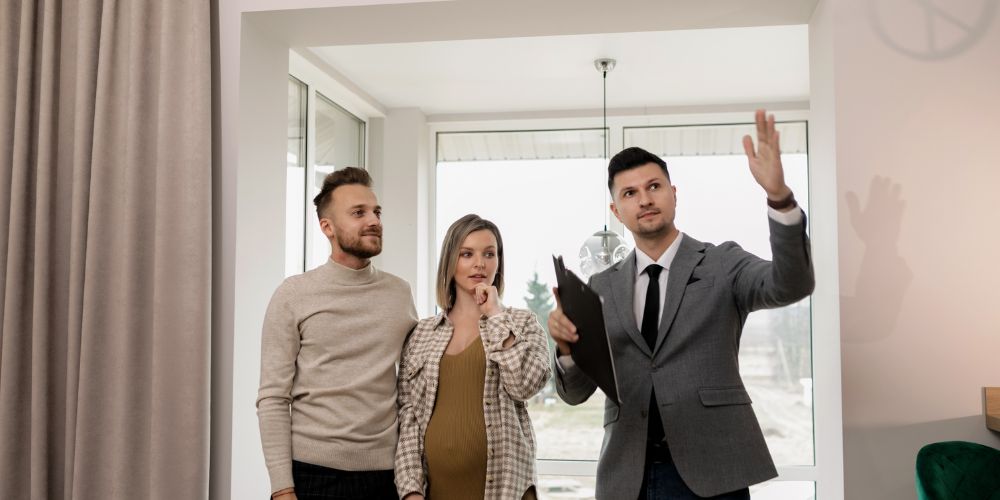 Client with real estate agent on a house tour